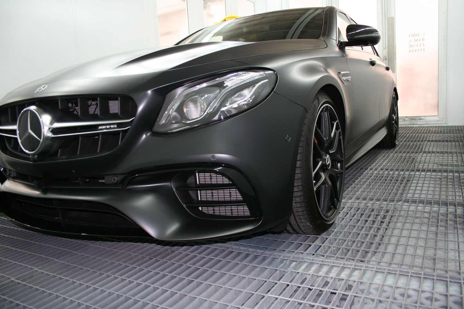 Matte black Mercedes-Benz AMG E63 in Miranda Auto Body spray booth