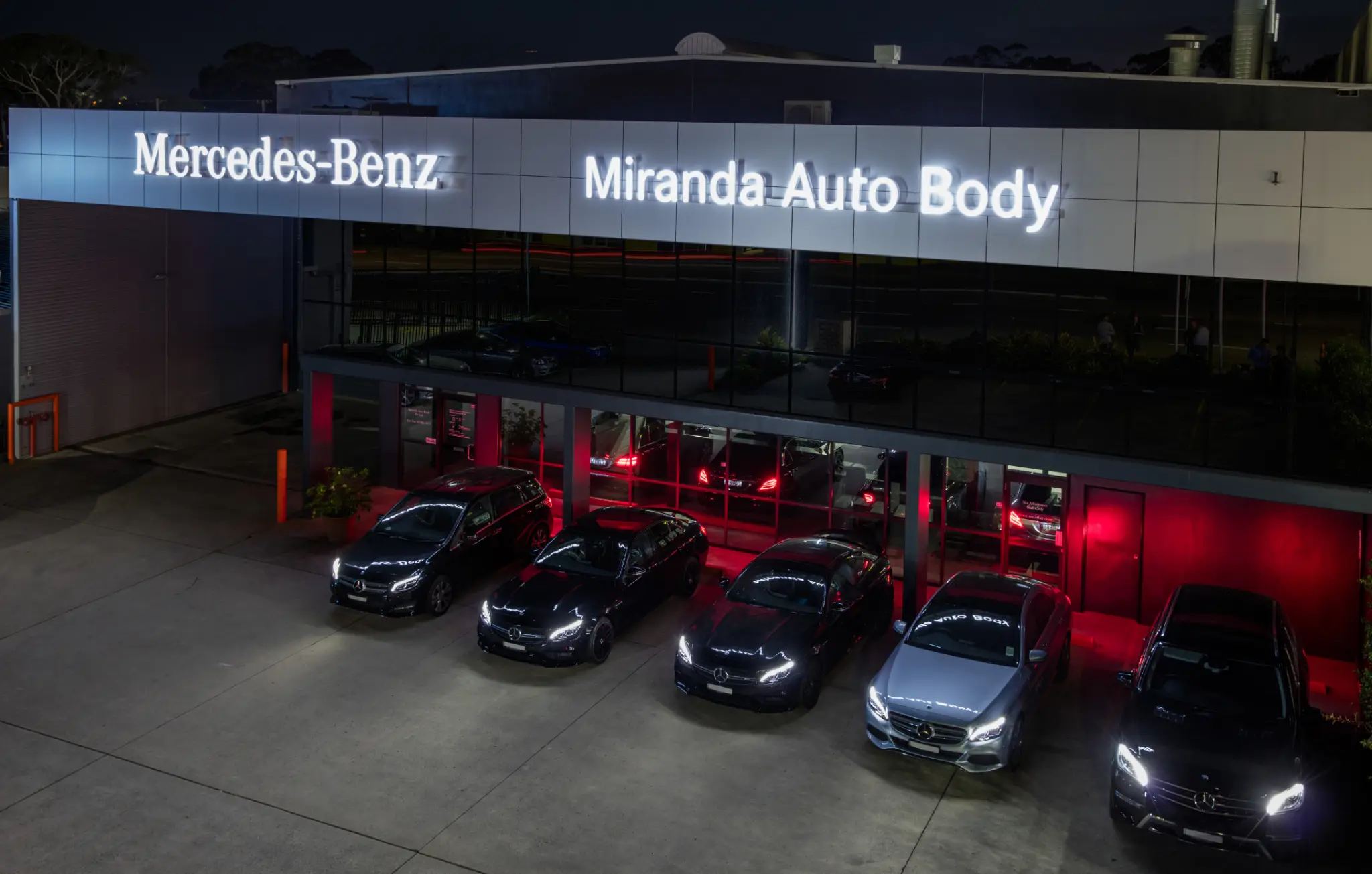 Miranda Auto Body — Caringbah workshop exterior at night